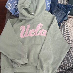 Divided Green Hoodie with Pink Lettering